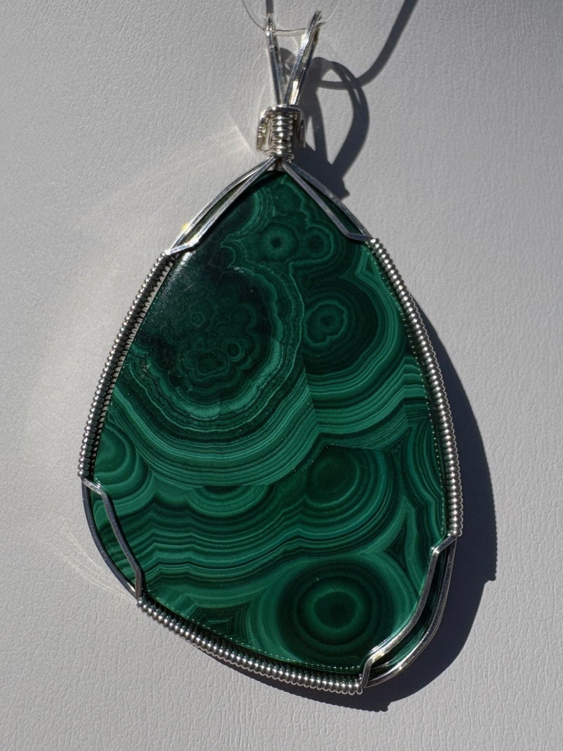 Malachite wrapped in Sterling Silver
